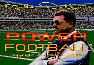A man wearing sunglasses and dark clothing is positioned in the center-right of the screen against a stadium background filled with spectators. Large yellow text reading "POWER FOOTBALL" is displayed prominently in the upper portion, with smaller text below indicating "Copyright Accolade Inc." The field and stadium seats are visible behind the figure, rendered in green and blue tones typical of Sega Genesis graphics. The overall composition uses a portrait-style layout centered on the man's face and upper body against the sports venue backdrop.