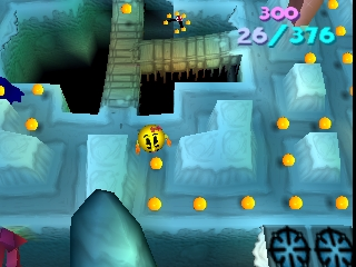 A 3D isometric ice-themed maze level displays Ms. Pac-Man navigating frozen blue platforms and structures. Yellow pellets scatter across the stage, with a score counter showing 300 points and 26/376 in the upper right. The level features elevated pathways, icy walls, and geometric architecture rendered in blue and teal tones against a darker background with visible depth and parallax layers.