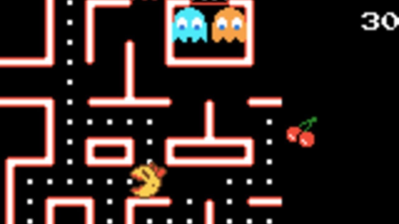 A maze-like level with red outlined corridors on black background. Ms. Pac-Man appears as a yellow character in the lower-left area. Two ghosts are visible at the top—a cyan ghost on the left and an orange ghost on the right—inside a ghost pen. A red fruit with a green stem is positioned in the right-center area. White dots line the corridors. The number '30' appears in the upper-right corner. Pixel art style typical of early handheld game systems.