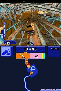 A racing game overhead view shows a car driving through a gray concrete structure with support beams. The HUD displays a lap counter reading 1er at the top left, a speed indicator showing 10 448 in the center, and a time of 01:19.6 at top right. Below the main view is a radar map with blue and orange elements indicating the track layout. A blue electrical effect animates across the lower portion of the screen.