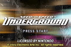 The Need for Speed Underground title screen displays the game's logo prominently in the center, rendered in white and gray with a striped speedometer-style design. Below the logo sits a "PRESS START" prompt in white text. The background features a blurred, dynamic composition of warm orange and cool blue tones suggesting motion and urban elements. At the bottom, licensing text reads "LICENSED BY NINTENDO" and "© 2003 Electronic Arts. All rights reserved." The overall visual style employs a low-resolution pixel art aesthetic typical of Game Boy Advance titles, with a dark background and high-contrast UI elements.
