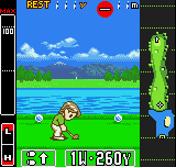 A golfer character stands on a fairway with a golf ball positioned in the center of the screen. The scene displays a wide, green landscape with blue water hazard on the left, distant mountains under a blue sky with white clouds, and a vertical power meter bar on the right side. The UI shows a score of 260 yards at the bottom, with red health or energy indicators at the top left corner. The graphics use bright, solid colors typical of Game Boy Color's limited palette, with flat sprite-based rendering and minimal detail in the background elements.