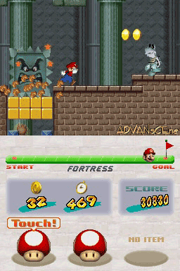 A side-scrolling platformer level displays Mario jumping across brick platforms while avoiding a large cat-like enemy on the left side. Two yellow floating orbs hover in the upper right above a white pipe. The UI shows a lives counter (33), coin counter (449), score (30830), and three power-up icons at the bottom including two red mushroom-style items. A green goal flag appears in the lower right corner. The level uses a gray stone brick wall background with green vertical pipes and brown brick platform sections in the foreground.