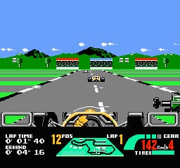 A Formula 1 race car viewed from behind sits centered on a gray asphalt track stretching toward the horizon. Two rows of grandstands with red roofing flank the track sides beneath a blue sky with white clouds. A green grass area and distant hills form the background. The bottom third displays a cockpit view with the driver's hands on the steering wheel, flanked by two green fuel gauges on left and right. Text panels show race statistics including lap count, speed, and tire condition. The pixel art uses bright primary colors typical of early 1990s NES graphics.