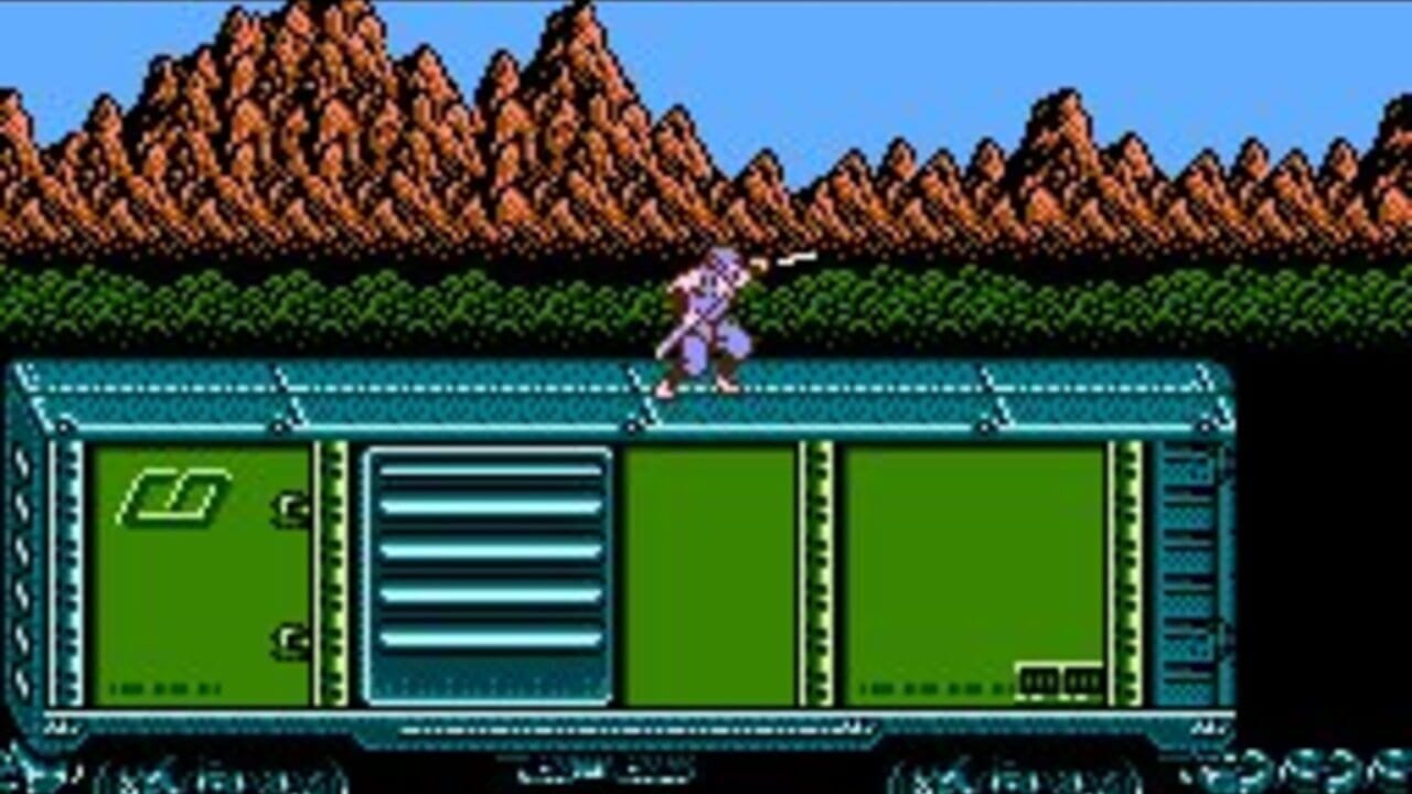 A purple ninja character runs along the top of a teal-colored industrial structure with multiple green-paneled compartments separated by cyan vertical dividers. A horizontal ventilation grate with cyan slats appears in the center panel. Rocky brown mountains with black outlines are visible in the upper background against a blue sky. The sprite uses 8-bit pixel art typical of NES-era graphics.