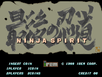 The title screen displays large Japanese characters with an ornate stone texture effect at the top center, overlaid with yellow and white "NINJA SPIRIT" text. Below the title, a standard arcade menu shows "INSERT COIN", "1PLAYER ICON", and "2PLAYERS 2COINS" options on the left side, while the right side displays the Irem copyright notice "© 1988 IREN CORP." and "CREDIT 00" in a light gray font. The background is a muted tan color with small decorative dots. A small red seal symbol appears in the bottom right corner.