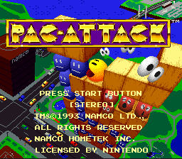The title screen displays "PAC-ATTACK" in large yellow letters at the top. Below sits a 3D isometric game board with stacked colored blocks and Pac-Man in yellow, surrounded by blue ghosts. Text reads "PRESS START BUTTON [STEREO]" in green, followed by copyright information: "1992-1993 NAMCO LTD. ALL RIGHTS RESERVED," "NAMCO HOMETEK INC." and "LICENSED BY NINTENDO." The background is solid blue with green geometric shapes in the upper corners, creating a retro Game Boy aesthetic with minimal color palette.