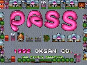 The title screen displays large pink bubble-letter text reading 'PASS' centered on a gray background filled with small building and urban tile sprites. Below the title, white text reads '1992 OKSAN CO.' followed by additional Japanese characters. The screen's borders are lined with repeated small pixel-art structures including houses, shops, and trees in a top-down perspective view, forming a decorative frame around the central title area. The overall aesthetic uses a limited 8-bit color palette with bright pinks, blues, and earth tones typical of early 1990s arcade graphics.