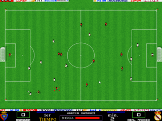 A top-down soccer field view displays 22 player sprites positioned across the pitch in two teams wearing contrasting colors. White dotted lines mark passing lanes between players, while the center circle and halfway line divide the rectangular field. Goal areas with nets are visible on both ends. A status bar at the bottom contains team emblems, player statistics, and score information in a DOS-era interface with pixelated UI elements.