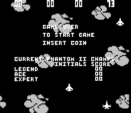 The title screen displays "PRESS START BUTTON TO START GAME" and "INSERT COIN" centered on a black background. Below, white text reads "CURRENT PHANTOM IS CHAMP" with "LEGEND ANIMALS" and "ACE EXPER" visible. Small pixelated cloud and spaceship sprites scatter across the screen in white. Two rows of six identical enemy ship graphics appear at the top and scattered throughout, rendered in simple monochrome pixel art typical of early 1980s arcade games.