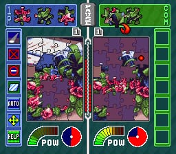 A split-screen gameplay layout shows two puzzle board areas side-by-side, each containing a grid filled with colorful flowers and vegetation in shades of purple, pink, and green. The left and right screens display identical puzzle fields with blooming plants scattered across dark backgrounds. At the bottom of each screen sits a power meter with a red circular indicator and a POW button. The top of the screen shows icon panels for gameplay options and a status bar. The overall visual style uses bright, contrasting 16-bit sprites with a flora-themed aesthetic in a tile-based puzzle format.