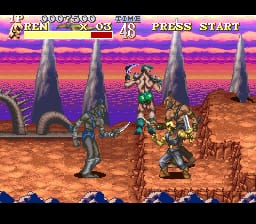 A side-scrolling combat scene displays two animated characters facing each other on a brown terrain with tall stone pillars in the background. A vibrant pink and purple gradient sky with orange clouds fills the upper portion. The HUD shows health bars at the top left, a score counter in the upper center, and a "PRESS START" prompt in the upper right. The sprite-based characters are rendered in colorful pixels against the desert-like landscape with a blue ground line at the bottom. The art style features 16-bit color depth with parallax layering visible in the background elements.