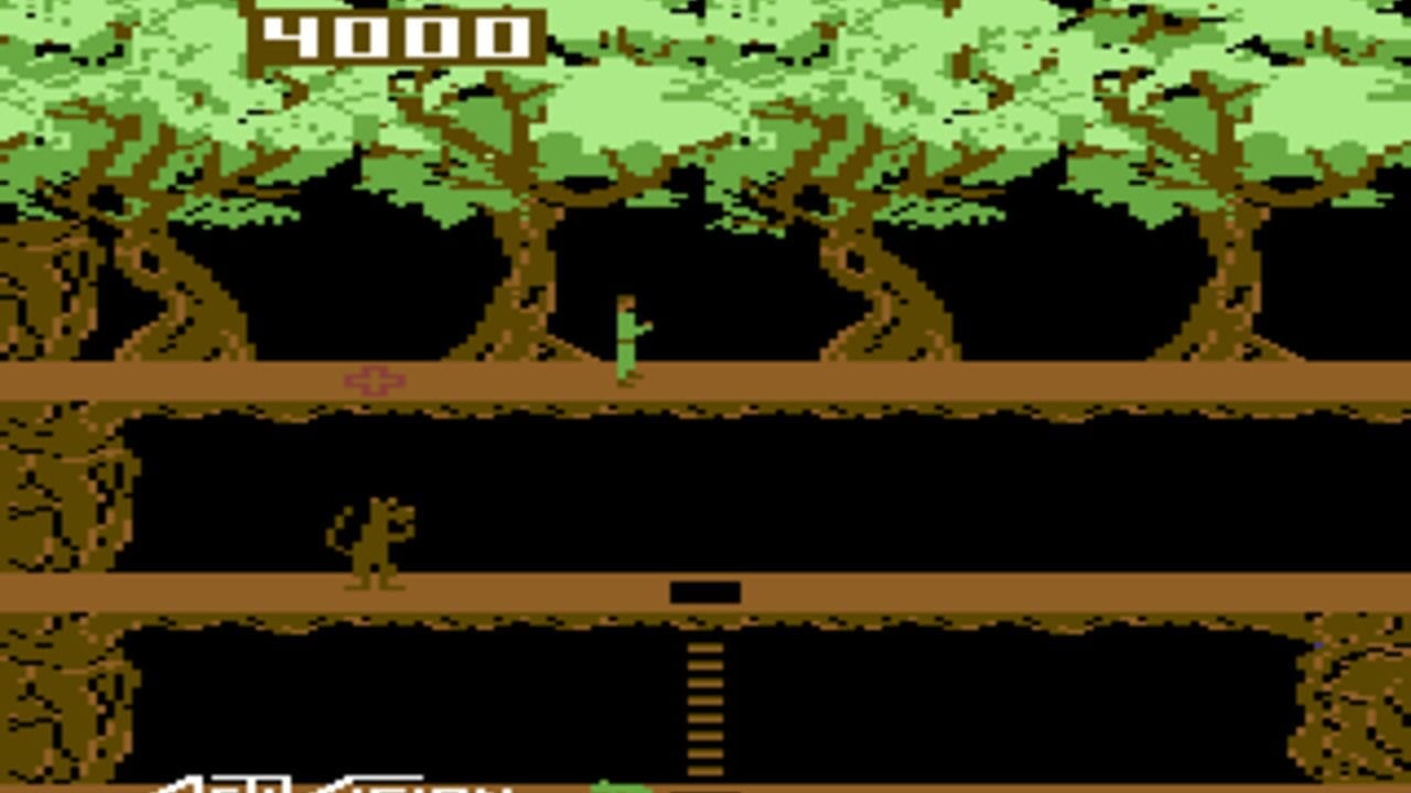 A pixelated platformer scene displays a green character standing on a brown platform within a jungle setting. Multiple layered horizontal platforms separated by black voids create the vertical level structure. Gnarled tree trunks with green foliage frame the sides, rendered in low-resolution sprites with brown and olive tones. A second character or enemy figure appears on a middle platform. The score "4000" displays in white text at the top left. Vines and platform edges show the characteristic 8-bit color palette and chunky pixel rendering of early 1980s arcade-style graphics.