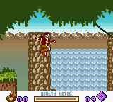 A side-scrolling platform level displays a beige stone structure with a brown wooden door on the left, set against a green treetop background and blue water at ground level. The player character in purple stands on the ground floor. Purple circular UI elements appear in the bottom left and right corners, likely representing health or inventory. The scene uses low-resolution pixel graphics typical of Game Boy hardware, with a limited color palette of greens, browns, blues, and earth tones.