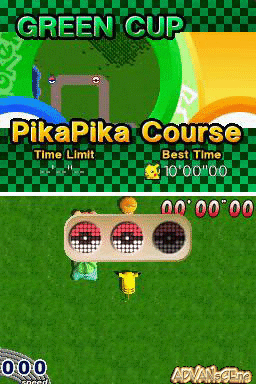 A top-down racing course labeled PikaPika Course displays a green circular track with a starting position marked by three circular target rings at the bottom center of the screen. A small character sprite stands near the rings. The upper portion shows "GREEN CUP" with a map thumbnail and time information displaying a best time of 10'00"00. The bottom left corner shows elapsed time 0'0"00, and the right side shows current time 0'0"00. The art style uses bright primary colors with a checkered green pattern visible at the top edge.