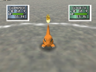 An orange Pokémon with a pointed head shape stands centered on a gray battlefield arena. Two information panels appear at the top of the screen: the left panel shows "CHARMANDER" with "LV 14" displayed in white text on a dark background, while the right panel shows "CHARMANDER" with "LV 45" in green text. A small yellow sparkle or particle effect hovers above the Pokémon. The 3D graphics show a smooth, polygonal style typical of N64 era games, with a flat gray ground and atmospheric gray sky in the background.
