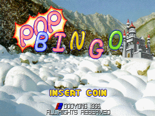 The title screen displays large colorful letters spelling "POP BINGO" in red, pink, blue, and green against a snowy mountain landscape with a pagoda structure visible in the background. Below the title, yellow text reads "INSERT COIN" followed by "PUSH START BUTTON" and "ALL RIGHTS RESERVED" in smaller text. The scene uses a low-resolution pixel art style typical of mid-1990s arcade graphics, with a blue sky, white snow-covered terrain, and distant mountainous terrain forming the backdrop.