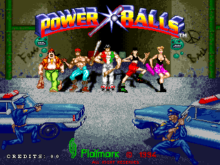 The Power Balls title screen displays the game logo at the top in blue and yellow text with a star burst effect. Below stands a horizontal row of seven cartoon characters in varied poses and colorful clothing against a gray concrete background with green walls. Two blue arcade gun cabinets appear in the foreground at bottom left and right. Text reading 'CREDITS: 00' and a copyright notice appears at the bottom of the screen in green monospaced font.