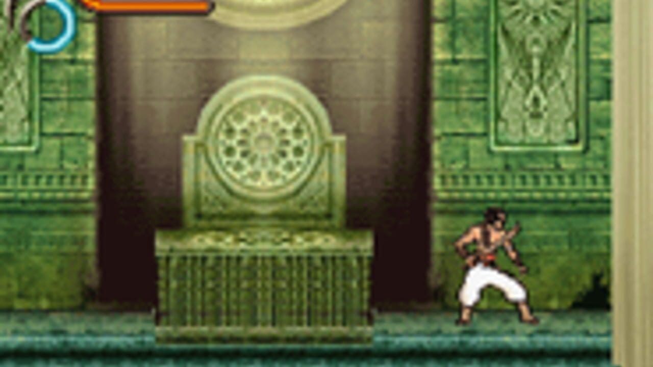 A character in a brown tunic and white pants stands in a fighting stance on a teal platform within an ornate palace chamber. Green decorative walls with geometric patterns flank both sides, featuring intricate tilework and carved panels. A large dark wooden door with an elaborate circular golden emblem occupies the center background. The sprite-based graphics use a limited color palette typical of Game Boy Advance hardware. A blue circular UI element appears in the upper left corner of the screen.