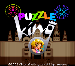 The title screen displays "PUZZLE KING" in large colored letters across the center, with a blonde female character in a yellow dress positioned below the text. Behind her stands a stylized castle with multiple tall spires and turrets rendered in brown and tan tones. Concentric circular patterns in pink and blue appear in the upper corners. The background is solid black. Copyright text reading "© 2002 K1 Soft & JAHN System All right reserved" appears at the bottom in white text.