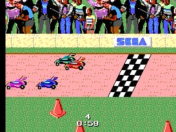 A top-down racing view shows three remote-control cars on a pink dirt track with grass borders. A red car leads in the center, while blue and purple cars follow behind on the left side. A checkered finish line flag appears on the right edge. Spectators in blue and black stand in the background behind a SEGA banner. Two red traffic cones sit on the lower grass verge, and a lap counter displaying '0-59' appears at the bottom center of the screen.
