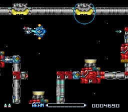 A side-scrolling spaceship navigates a vertical industrial corridor with stacked red and metal structures in the center. The player's blue ship occupies the left-center area while enemy craft appear in the upper corners. A score display showing 0004590 and a health/shield bar occupy the bottom left. Black starfield background dominates the screen. Pixelated sprites and a red metallic color palette define the visual style typical of early 1990s 16-bit shoot-em-ups.