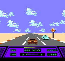 A first-person driving view shows a gray road stretching toward the horizon against a purple sky filled with white pixelated clouds. A red car is visible in the center-left lane ahead, and a teal vehicle appears in the right lane. A diamond-shaped road sign stands on the right side. The bottom of the screen displays a purple HUD bar with game metrics: TIME, SPEED (226 KM/H), SCORE, and a fuel gauge indicator showing remaining capacity. The road features painted lane markings and exhibits parallax scrolling with the desert landscape visible at the horizon.