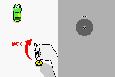 A split-screen gameplay scene displays a hand-drawn character sprite of a green frog or creature in the upper left, with Japanese text reading "はじく" (hajiku, meaning "flick") and a red curved arrow indicating a flicking motion. The lower half shows a simplified line-drawn hand performing the action, while the right side contains a gray circle with a small dot inside against a gray background, likely representing a target or object. The visual style uses simple line drawings and basic colors typical of retro rhythm game interfaces.