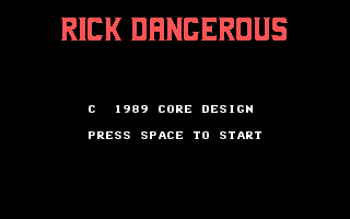 The title screen displays "RICK DANGEROUS" in large red pixelated text at the top against a black background. Below, white text reads "© 1989 CORE DESIGN" and "PRESS SPACE TO START" in a standard bitmap font. The entire interface uses a minimal, early DOS-era aesthetic with red and white colors on black, typical of late-1980s computer game presentations.