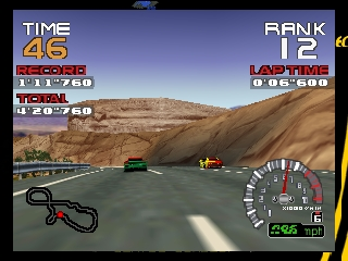A racing scene displays a desert landscape with brown rocky cliffs and sandy terrain. Two vehicles race on a gray asphalt road in the middle ground. The HUD shows time elapsed (46 seconds), rank position (12), lap time (1:06.686), and a circular speedometer in the lower right corner reading approximately 246 km/h. The top-left displays record times and totals in a vertical list format. A controller diagram appears in the lower left. The art style uses low-polygon 3D models with a tan and blue color palette typical of N64-era racing games.