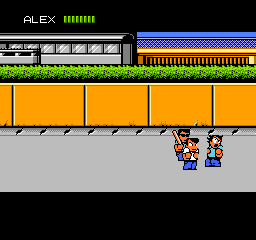 The screen shows a side-scrolling beat-em-up scene with two small pixel-art characters standing on gray pavement below an orange freight train with four visible cargo containers. The upper portion displays a scrolling train graphic in blue and yellow. A health bar labeled 'ALEX' appears in the top-left corner. The background is pure black, and the overall visual style uses bright primary colors typical of NES-era sprite graphics with distinct pixelation.