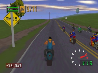 A motorcycle racer on a blue bike rides toward the camera on a straight asphalt road with dashed center lines. A yellow diamond-shaped road sign reading "9/11" stands in the upper left. On the right side of the road, five other racers on colorful bikes—some orange, red, and blue—travel in the same direction. Green rolling hills with trees fill the background under a blue sky with white clouds. A speedometer gauge displays 115 in the lower right corner, with "-3.5 DAVE" shown in the lower left, both rendered in red and white text.