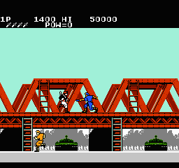 A blue soldier character stands on a gray platform in the lower-left area of the screen, facing red metal bridge structures with triangular truss patterns. Two identical red bridge sections with brown wooden framework occupy the upper half. Green vegetation patches sit beneath each bridge span. The HUD displays score 50000 at top right, with LP and stage indicators in the upper-left corner. Black sky fills the background. The sprite-based graphics use a limited color palette typical of NES-era action platformers.
