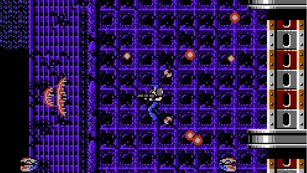 A pixelated action scene set in a purple grid-patterned industrial interior. The player character, rendered in gray and blue pixels, stands in the center of the frame wielding a large weapon. Multiple red and orange enemy sprites are scattered throughout the level—some airborne, others on platforms. Flaming projectiles streak across the left side. The right edge displays a building facade UI panel with brown, red, and gray rectangular sections. Small character sprites appear in the bottom corners. The overall color palette is dominated by purples and blacks with bright accent colors.