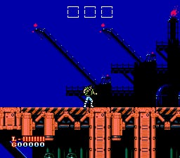A player character in red and white stands on an orange brick platform in the center of the screen against a bright blue background. Three red enemies with dark limbs appear above, two positioned diagonally upward to the left and right, and one in the upper right corner. The platform extends horizontally with a brick pattern, and the HUD displays a score of 500000 in yellow text at the lower left. The sprite work uses high contrast colors typical of NES-era graphics with sharp pixel definition.