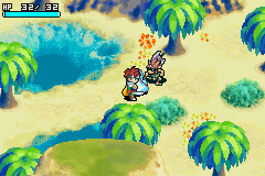 A top-down isometric view shows a character sprite in the center of a sandy beach environment with blue water, palm trees with green canopies, and brown terrain features scattered across the landscape. The Game Boy Advance's characteristic 240x160 pixel resolution and colorful 16-bit palette are evident. A health or status bar appears in the upper left corner, displaying numerical indicators. The sprite-based graphics use the GBA's typical limited color range with clear pixelation defining character and environmental assets.