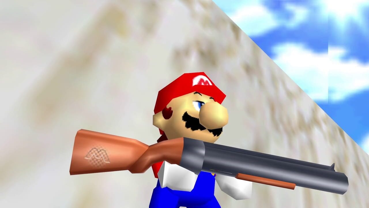 Mario, wearing his signature red cap and blue overalls, holds a rifle with a brown wooden stock and dark metal barrel across his body. He stands in a three-dimensional environment against a large beige stone wall with a blue sky visible in the upper right corner. The character model uses N64-era 3D rendering with simple geometric shapes and flat shading. Mario faces slightly to the right, displaying his classic mustache and defined facial features in the low-polygon art style typical of Nintendo 64 games.