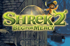 The title screen displays 'SHREK 2 BEG FOR MERCY' in large yellow-green letters at the top center, with Shrek's face visible in the upper right corner against a nighttime castle backdrop. The background shows a blue-toned stone building with architectural details. Below the title text, smaller white text reads 'PRESS START' on a dark semi-transparent overlay at the bottom of the screen. The overall color palette is dominated by cool blues and contrasting yellow-green text.