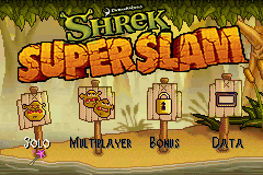 The title screen features "SHREK SUPER SLAM" in large orange and yellow lettering at the top center, set against a grassy outdoor background with ogre-themed visual elements. Below the title, a character sprite stands on the left side. Four menu options are arranged horizontally at the bottom: "MULTIPLAYER", "BONUS", and "DATA", with what appears to be a fourth option partially visible. The art style uses bright, contrasting colors typical of Game Boy Advance sprites and backgrounds, with a 2D cartoon aesthetic consistent with the Shrek franchise visual design.