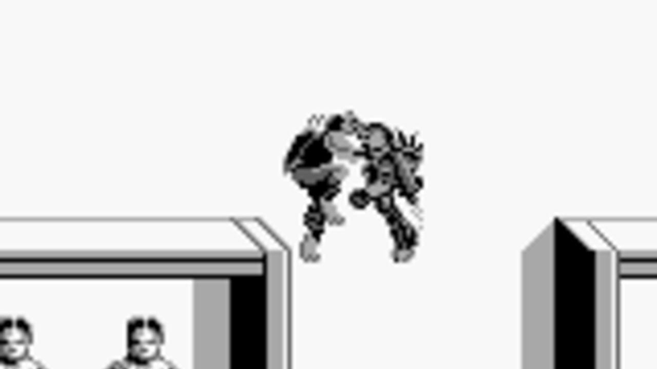 A pixelated robot character mid-jump suspended in air above a light gray background. Below are two small sprite figures on the left side and geometric platform structures with dark openings on either side. The monochromatic palette and chunky pixel art style are typical of Game Boy graphics. The scene depicts a platforming scenario with the player character airborne between two segmented platforms.