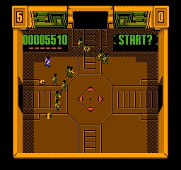 A top-down view of a brown arena with a player character centered on screen, surrounded by several small enemy sprites. The HUD displays a score of 0000510 in the upper left, with START? text in the upper right. Weapons and ammunition pickups are scattered throughout the floor. Orange borders frame the entire screen, and green health/status bars appear along the top edge. The pixel art uses a limited NES color palette with brown floor tiles, darker brown walls, and bright sprite colors.