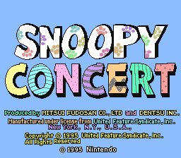 A title screen displays large, colorful letter blocks spelling 'SNOOPY CONCERT' in a pastel palette of blue, yellow, pink, and green against a light blue background. Below the title, small white text lists development credits including publisher Pax Softonica and Nintendo. The text appears pixelated and renders in the 16-bit SNES resolution style typical of early 1990s games.