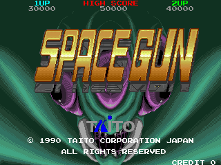 The title screen displays "SPACEGUN" in large yellow 3D-style lettering with purple and magenta shading effects in the center. Three purple alien heads with glowing magenta mouths are positioned above and around the text. The top of the screen shows three score displays reading "CUP 30000", "HIGH 360000", and "CUP 40000" in red and white text. A green gradient background creates a sci-fi atmosphere. Copyright text "© 1990 TAITO CORPORATION JAPAN" and "ALL RIGHTS RESERVED" appears at the bottom left, with "CREDIT 0" shown in the bottom right corner.