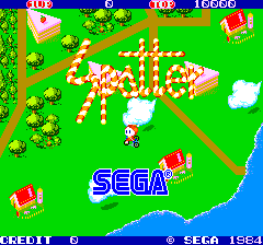 The title screen features the word "Spatter" rendered in large pink pixelated letters across the center of a bright green background. Below it, the blue SEGA logo is positioned centrally. The playfield shows a top-down isometric perspective with scattered small trees, bushes, and simple geometric terrain elements in yellow, red, and white. Score displays reading "10" appear in the upper corners, with "16660" visible in the upper right. At the bottom, a credit line reads "CREDIT 0" on the left. The color palette consists primarily of bright green, cyan blue, yellow, red, and white with low-resolution 8-bit sprite graphics typical of early 1980s arcade games.
