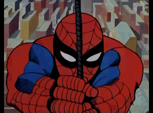 Spider-Man's upper body fills the center of the frame, rendered in bright red and blue with a black face mask. His fists are raised and clenched at chest level. The background shows a geometric pattern of tan, red, and blue angular shapes, suggesting an indoor environment. The sprite uses bold outlines and flat color fills typical of early 1990s arcade game graphics.