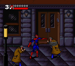 Spider-Man in red and blue stands center-left in a side-scrolling street level, facing two yellow-suited enemies. A brown stone building with barred windows and double doors occupies the right side. The HUD displays the score 3,1900000 at top-left in red text. Pixelated sprites and a dark purple stone texture palette characterize the SNES-era graphics. A yellow object appears on the left edge of the scene.
