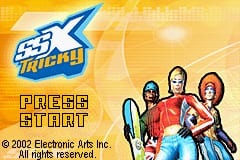 The SSX Tricky title screen displays the blue and white game logo in the upper left against a yellow and orange gradient background. Three snowboarders in colored outfits stand in the center-right area: one in green, one in red, and one in red with blonde hair. Yellow pixelated text reading "PRESS START" appears below the logo. At the bottom, white text credits "© 2002 Electronic Arts Inc." and "All rights reserved." The overall color scheme uses warm yellows and oranges with cool blue accents typical of Game Boy Advance-era graphics.