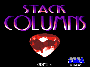 The title screen displays "STACK COLUMNS" in large purple text at the top, with each word stacked vertically. Below the title sits a prominent red gemstone or jewel with white highlights, centered on a black background. In the lower-left corner, white text reads "CREDITS 0". The SEGA logo appears in the lower-right corner in blue and white. The overall color scheme uses purple, red, white, and black against a dark background.