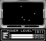 A Game Boy gameplay screen displays a space scene with a black background and scattered white dots representing stars. A gray rectangular border frames the play area. At the bottom, a status panel shows "POWER LEVEL" on the left with a depleting horizontal bar, and "PHASERS" and "SHIELDS" indicators on the right. The interface uses monochromatic green and black pixel graphics typical of original Game Boy hardware.