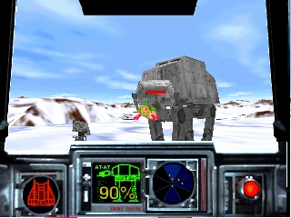 A first-person cockpit view displays an AT-AT walker centered on a snowy landscape with ice formations visible in the distance. The HUD shows a green targeting reticle, radar display on the right, shield status at 90% in the upper left, and various weapon indicators along the bottom panel. A red targeting crosshair and circular targeting sight frame the viewport. The scene uses a light blue sky with white snow terrain and brown rock formations.